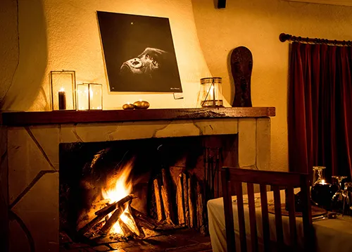"Fly by" positioned above a roaring fire at "Sabyinyo Silverback Lodge"